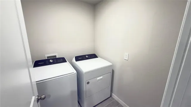 a utility room with dryer and washer