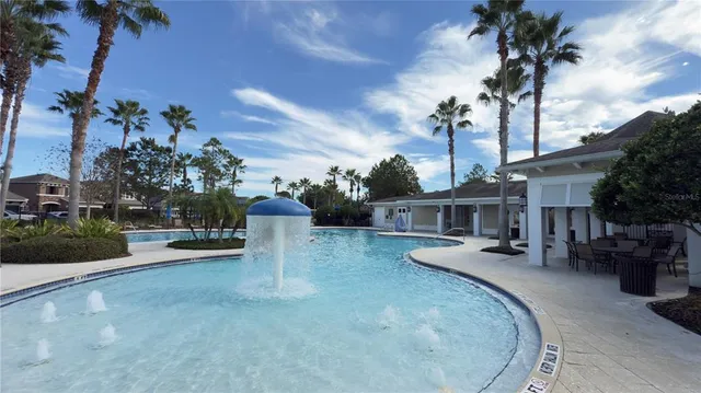 a view of a house with patio and a garden