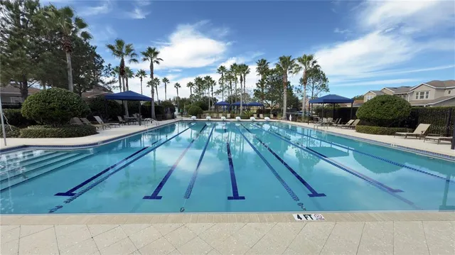 a view of a yard with swimming pool