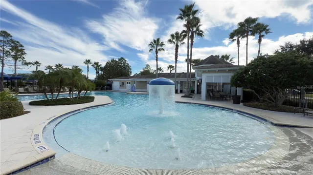 a view of a swimming pool with a patio