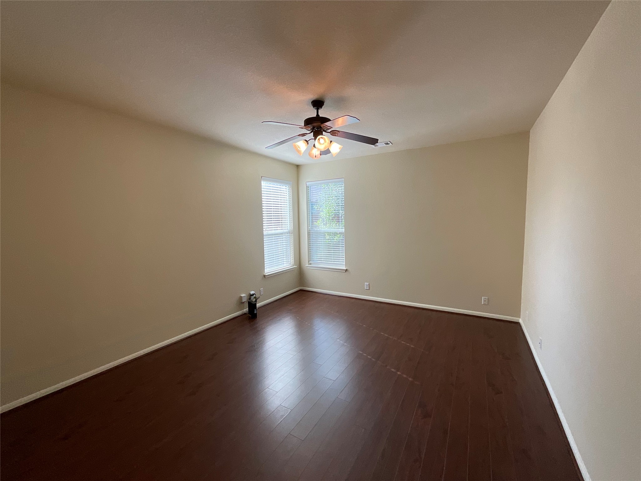 1911 Conn Creek Road Cedar Park, TX 78613 - Photo 21 of 39 a view of an empty room with wooden floor and a window