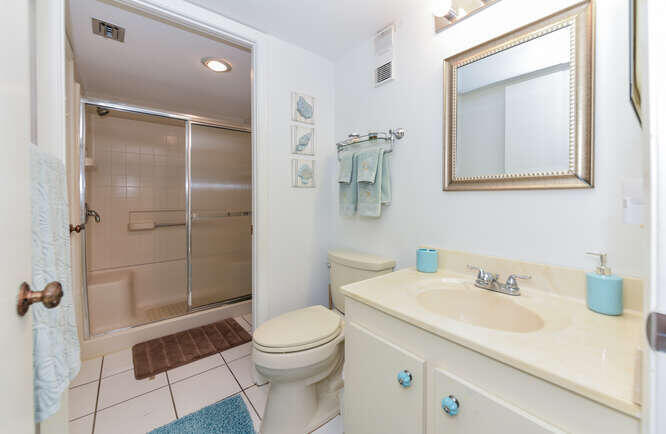 353 Highway 1, Unit A108 Jupiter, FL 33477 - Photo 18 of 36 a bathroom with a sink a toilet and shower