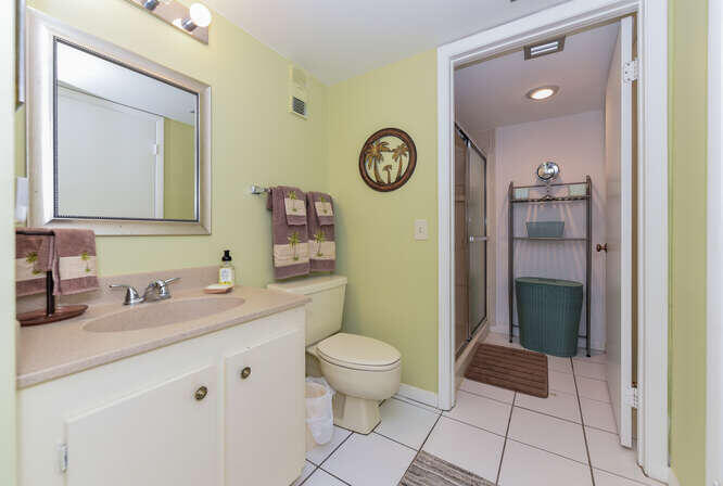 353 Highway 1, Unit A108 Jupiter, FL 33477 - Photo 19 of 36 a spacious bathroom with a toilet sink and mirror