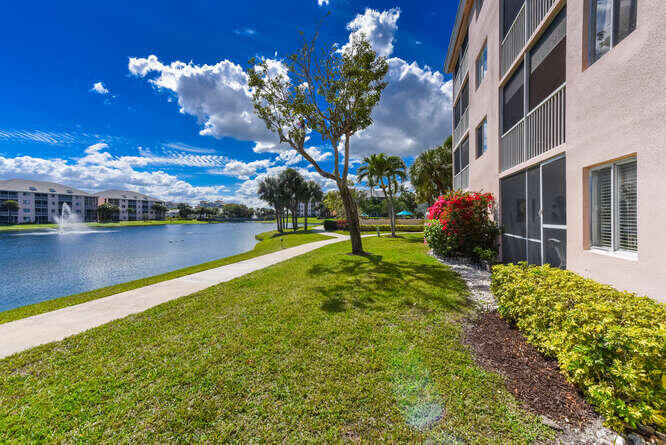 353 Highway 1, Unit A108 Jupiter, FL 33477 - Photo 26 of 36 a view of a lake with a house in the background