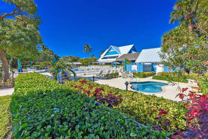 353 Highway 1, Unit A108 Jupiter, FL 33477 - Photo 28 of 36 a view of a house with swimming pool and sitting area