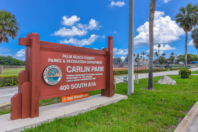 353 Highway 1, Unit A108 Jupiter, FL 33477 - Photo 33 of 36 a view of a sign board with a big yard