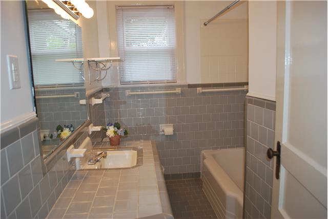 332 Jackson Road Portland, TN 37148 - Photo 6 of 9 Classic gray tile bathroom with cast iron tub