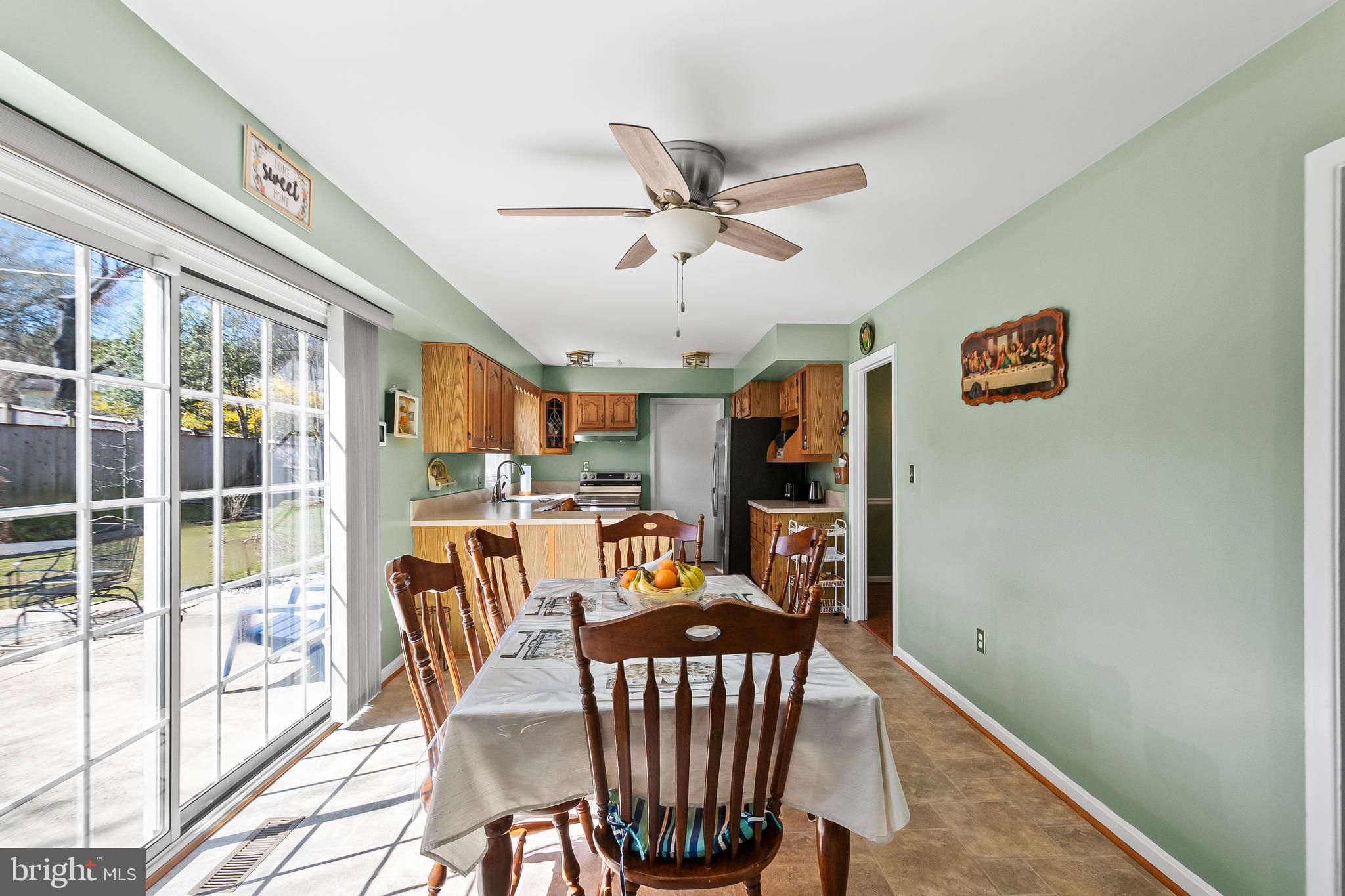 12613 Knowledge Lane Bowie, MD 20715 - Photo 11 of 32 a view of a dining room with furniture window and outside view