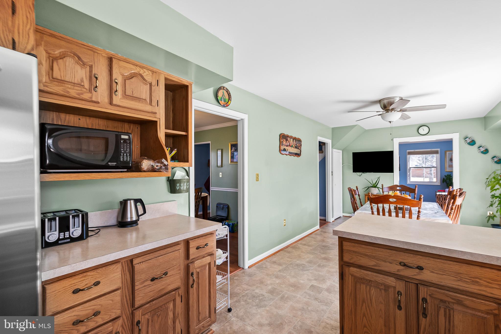 12613 Knowledge Lane Bowie, MD 20715 - Photo 15 of 32 a kitchen with stainless steel appliances granite countertop a sink and cabinets