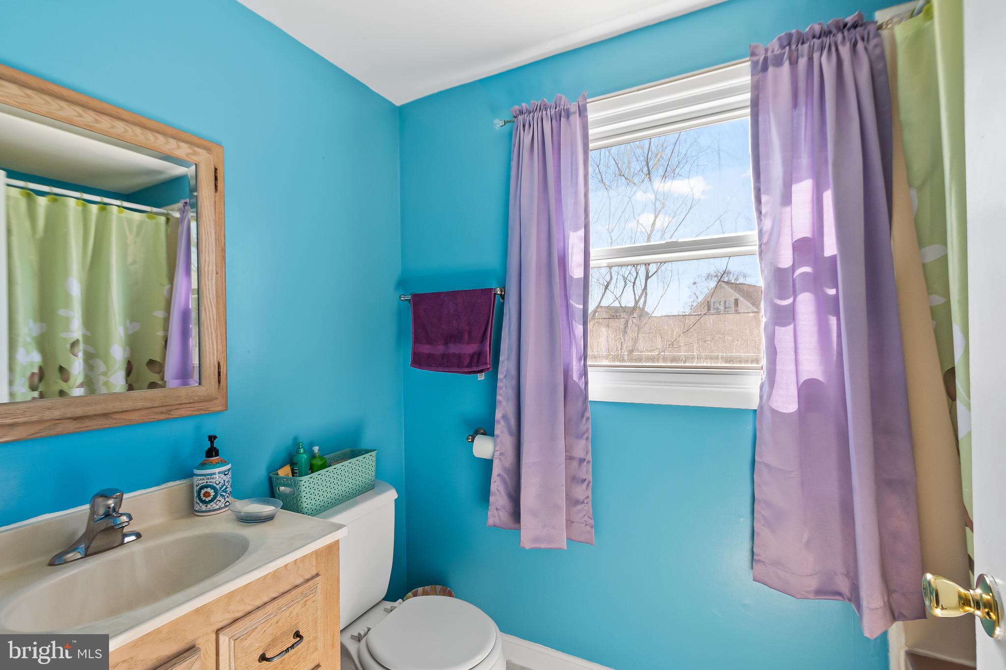 12613 Knowledge Lane Bowie, MD 20715 - Photo 19 of 32 a bathroom with a sink toilet and vanity