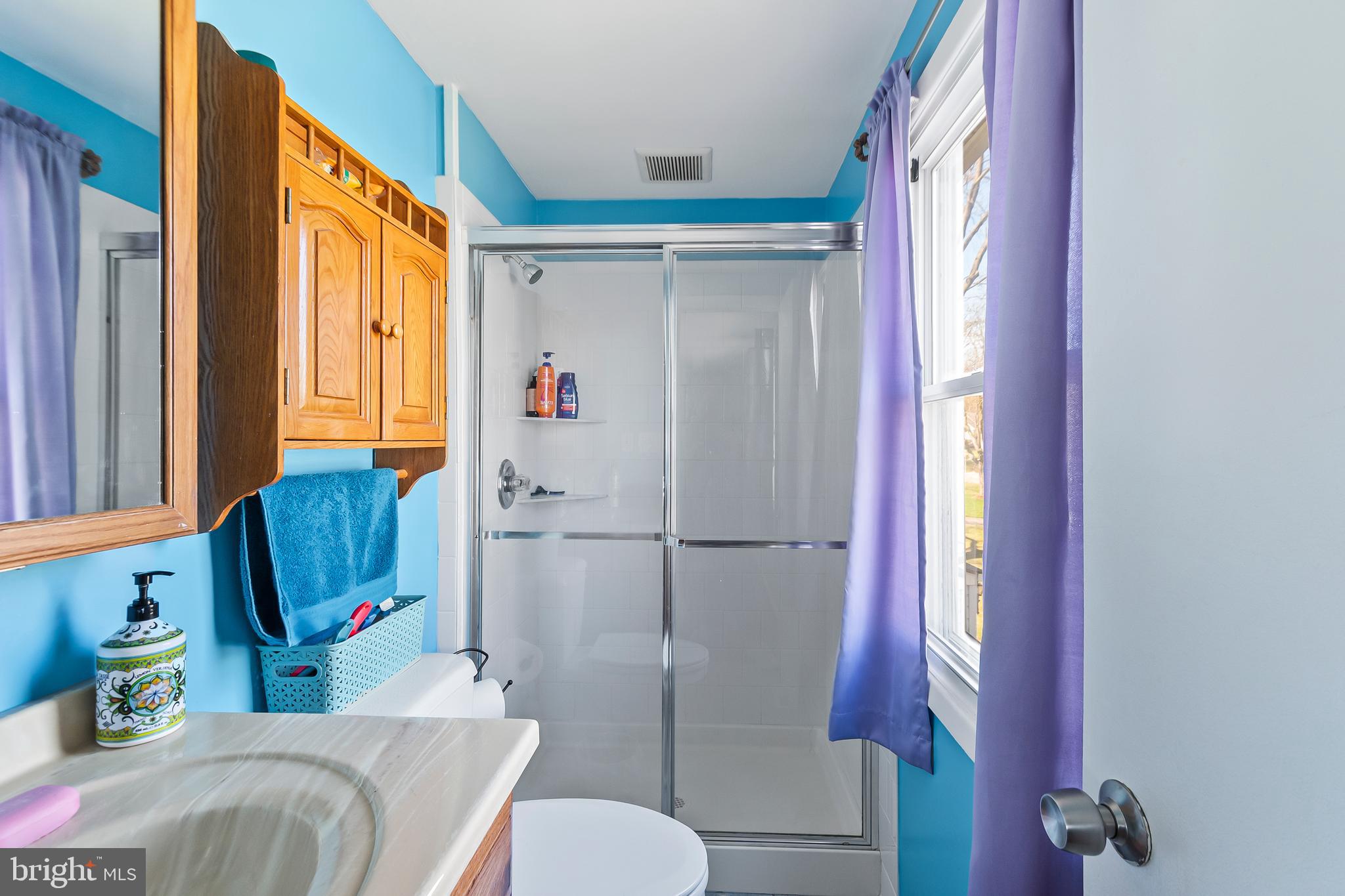 12613 Knowledge Lane Bowie, MD 20715 - Photo 27 of 32 a bathroom with a sink toilet and shower