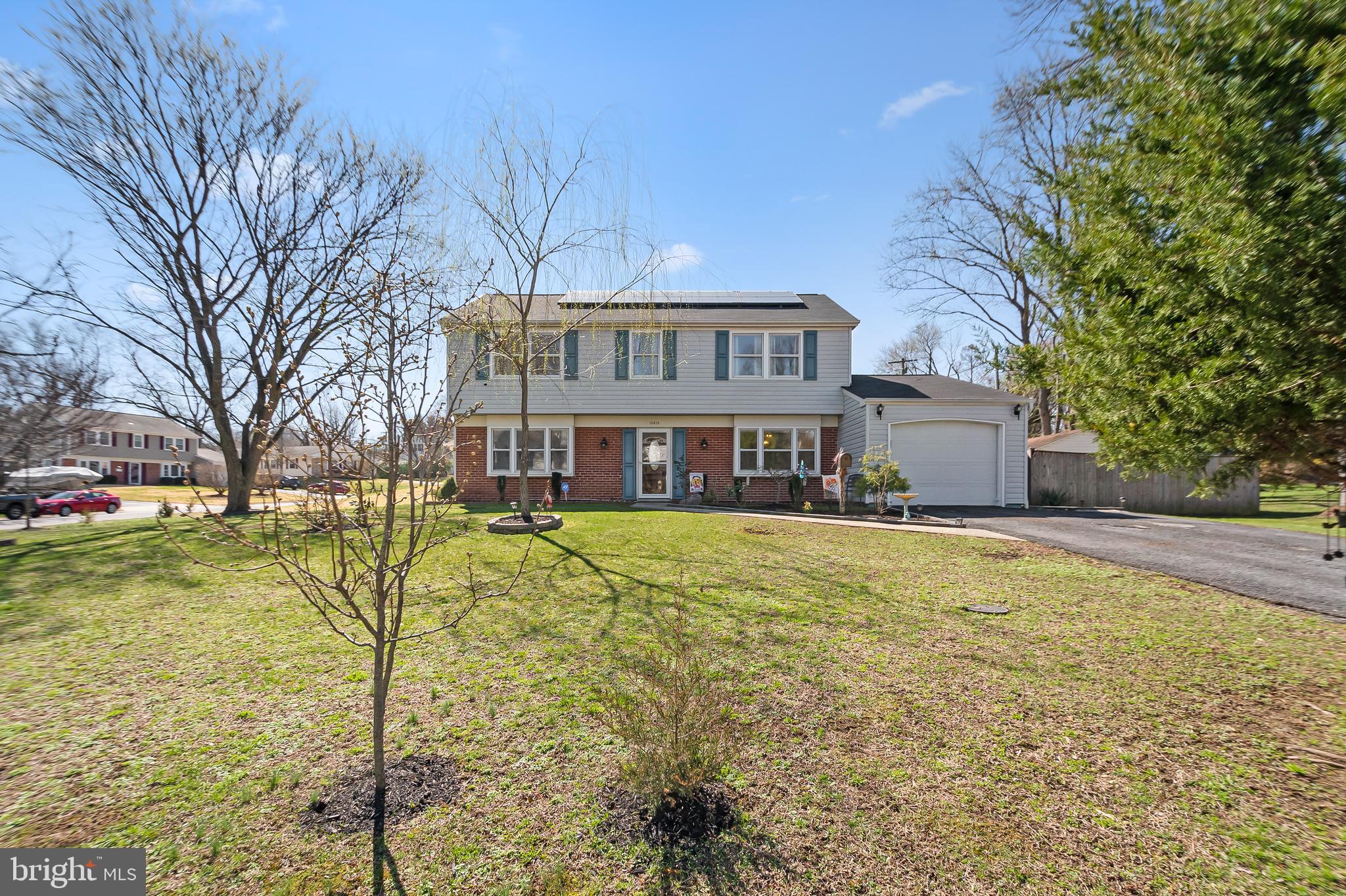 12613 Knowledge Lane Bowie, MD 20715 - Photo 3 of 32 a front view of a house with a yard