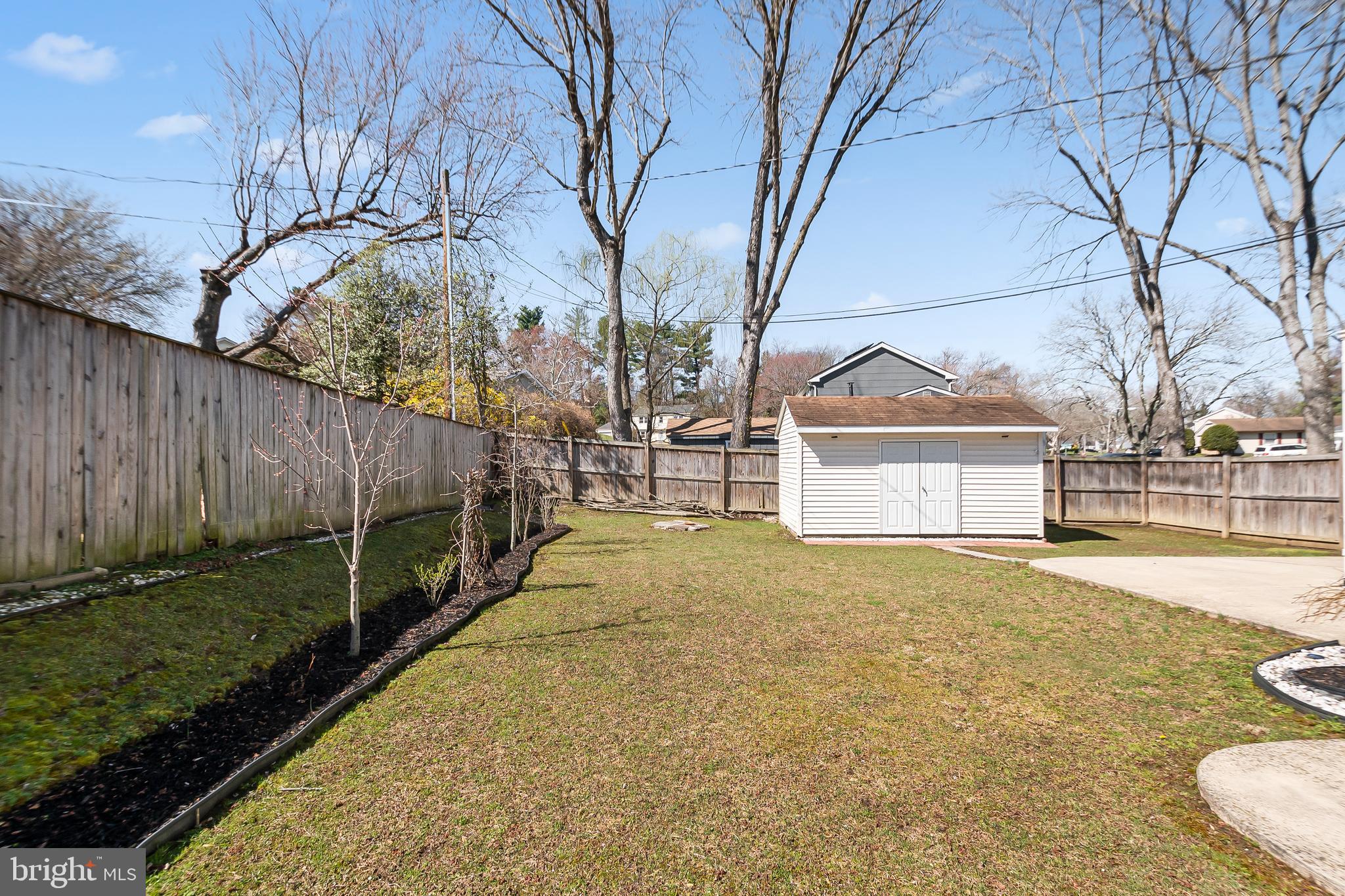 12613 Knowledge Lane Bowie, MD 20715 - Photo 31 of 32 a view of house with backyard and trees