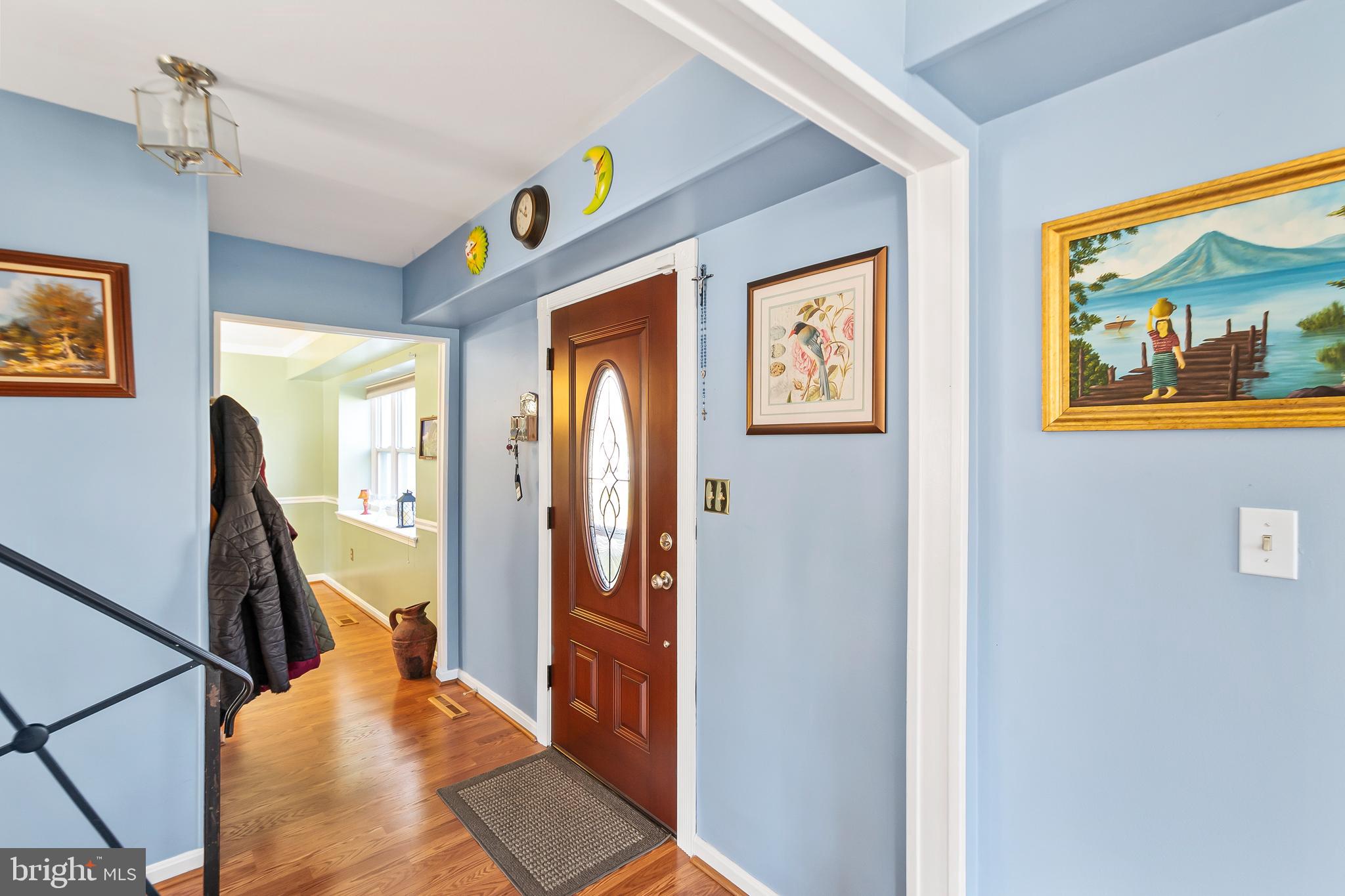 12613 Knowledge Lane Bowie, MD 20715 - Photo 5 of 32 a view of a hallway with furniture and front door