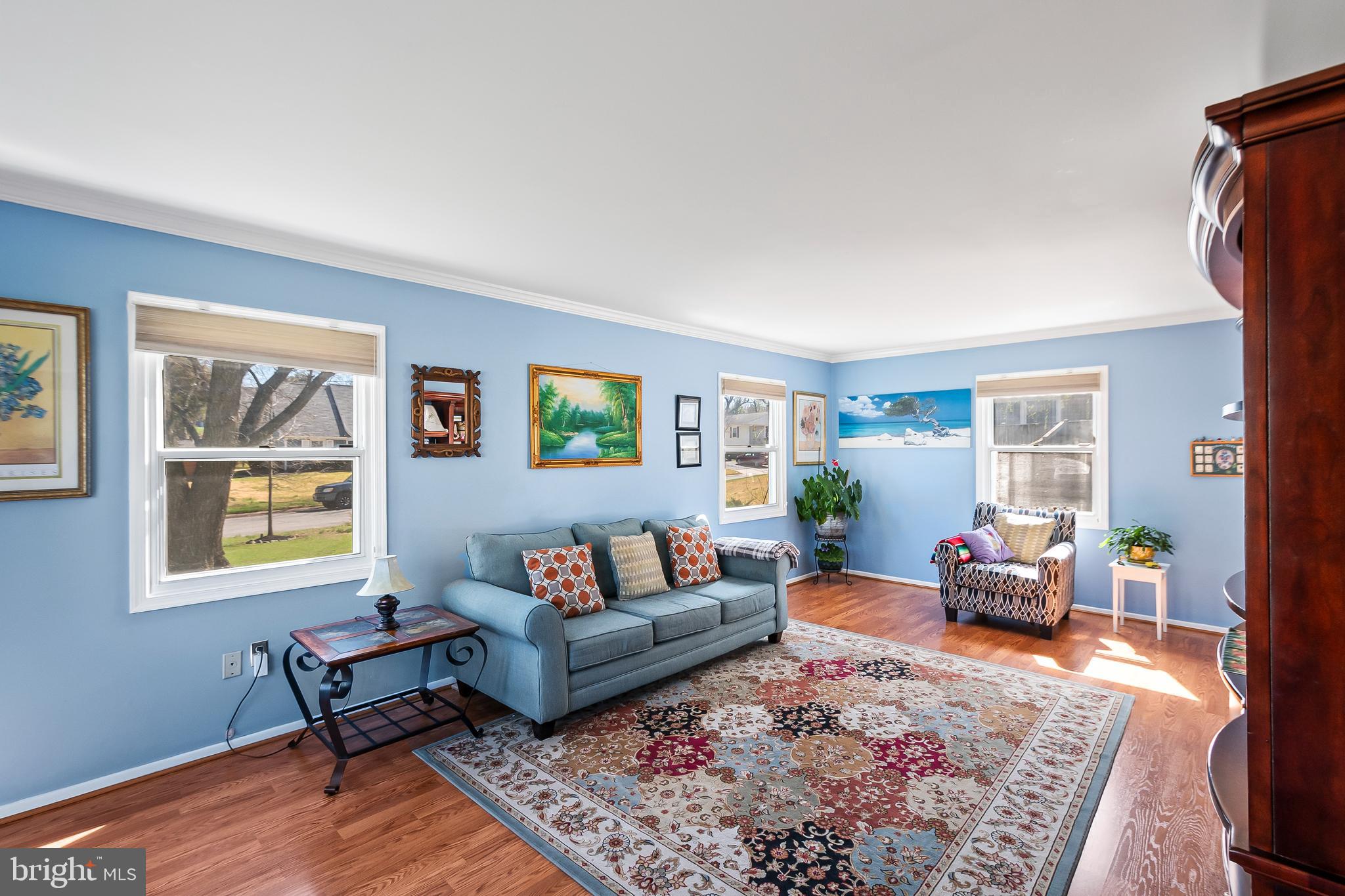 12613 Knowledge Lane Bowie, MD 20715 - Photo 6 of 32 a living room with furniture and a wooden floor
