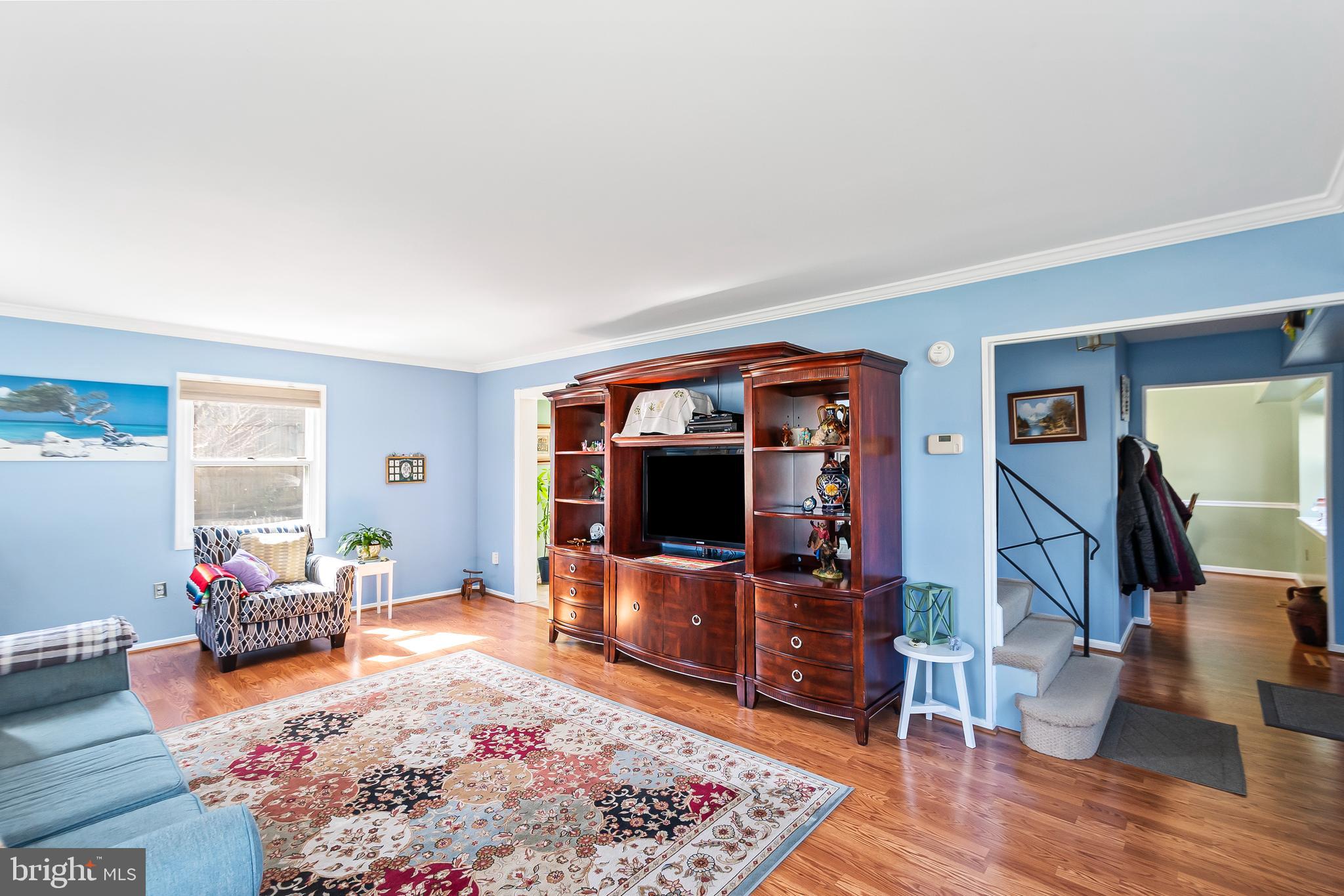 12613 Knowledge Lane Bowie, MD 20715 - Photo 7 of 32 a living room with furniture and a flat screen tv