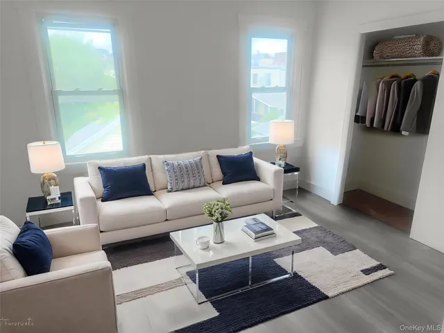 a living room with furniture and a window