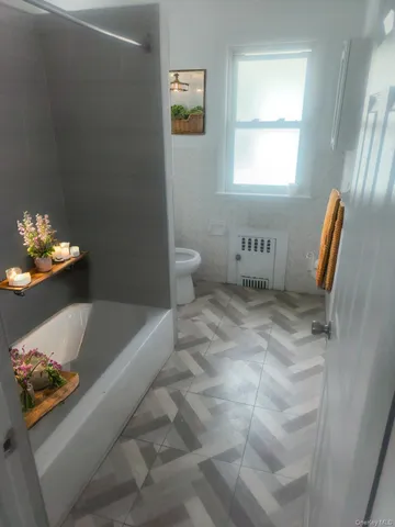 a bathroom with a sink toilet and a bathtub