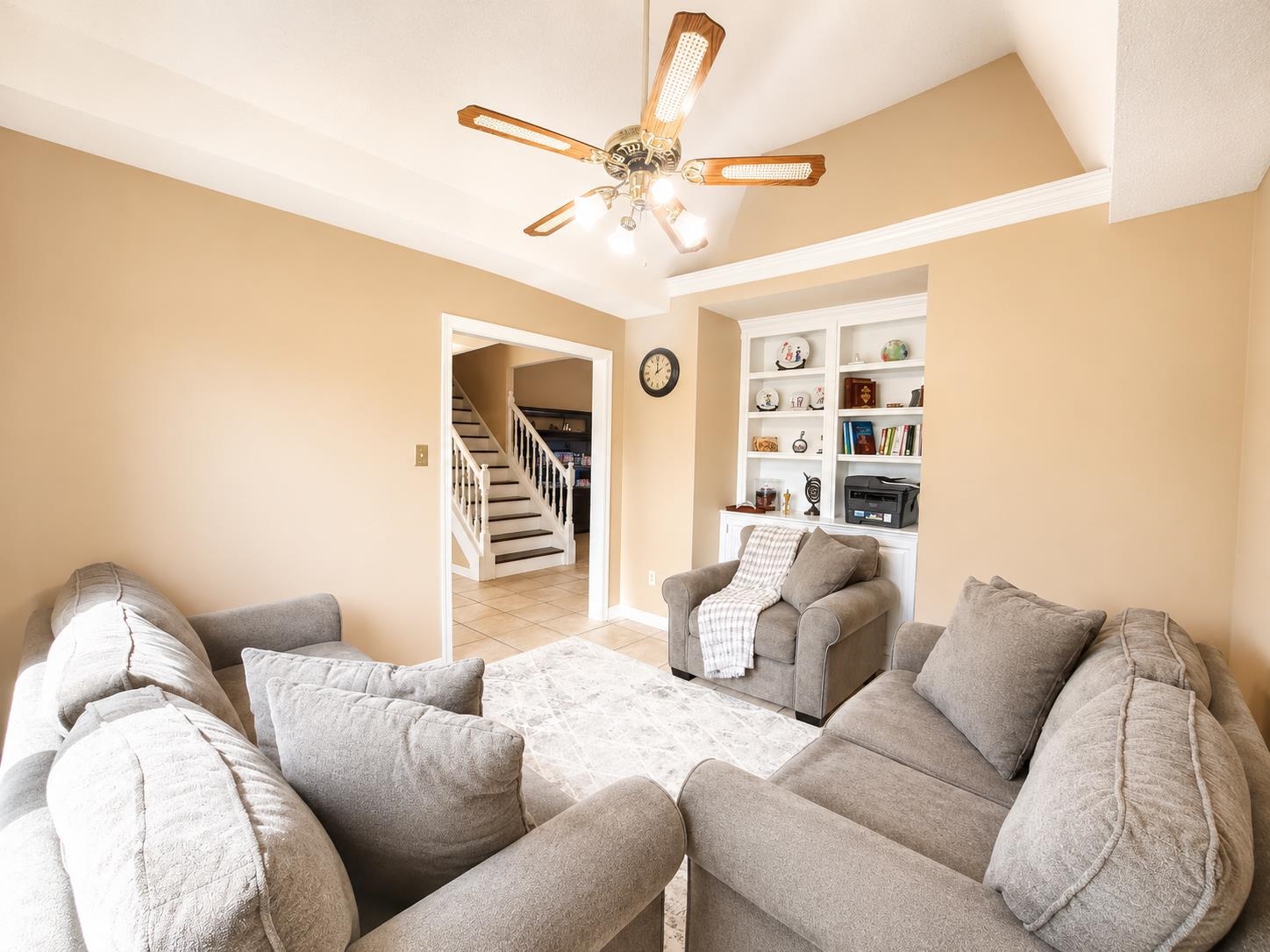 326 South Sanga Road Cordova, TN 38018 - Photo 10 of 32 Living area with vaulted ceiling, crown molding, and a built-in shelving unit