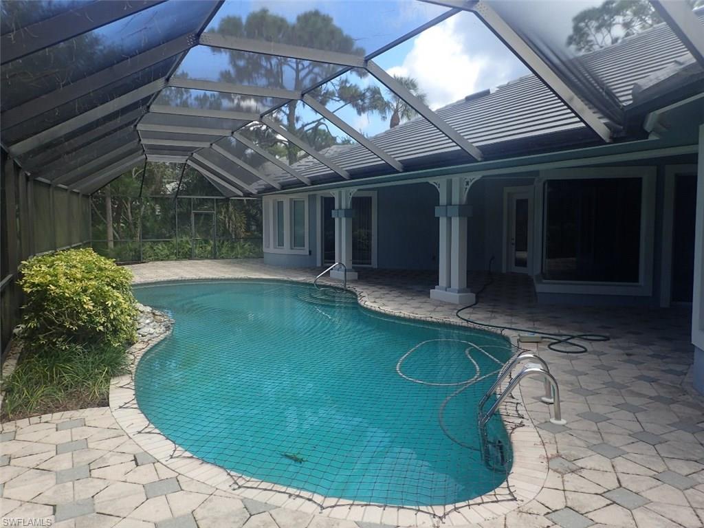 11623 Useppa Court Naples, FL 34110 - Photo 3 of 9 a view of a backyard