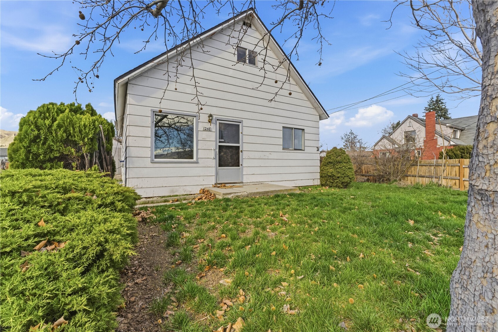 1248 South Mission Street Wenatchee, WA 98801 - Photo 1 of 22 a view of a house with a yard