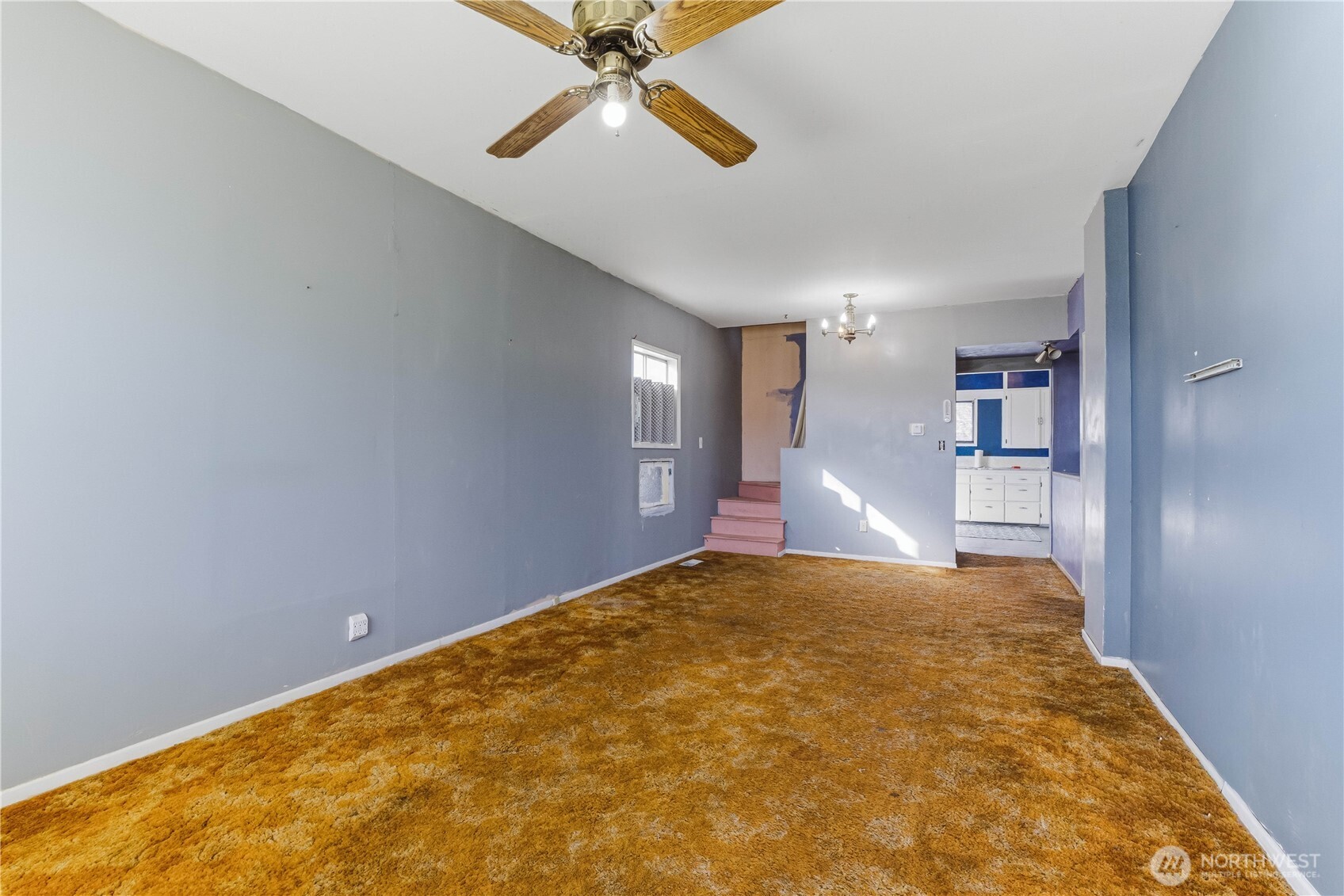 1248 South Mission Street Wenatchee, WA 98801 - Photo 2 of 22 a view of a big room with closet and a chandelier fan