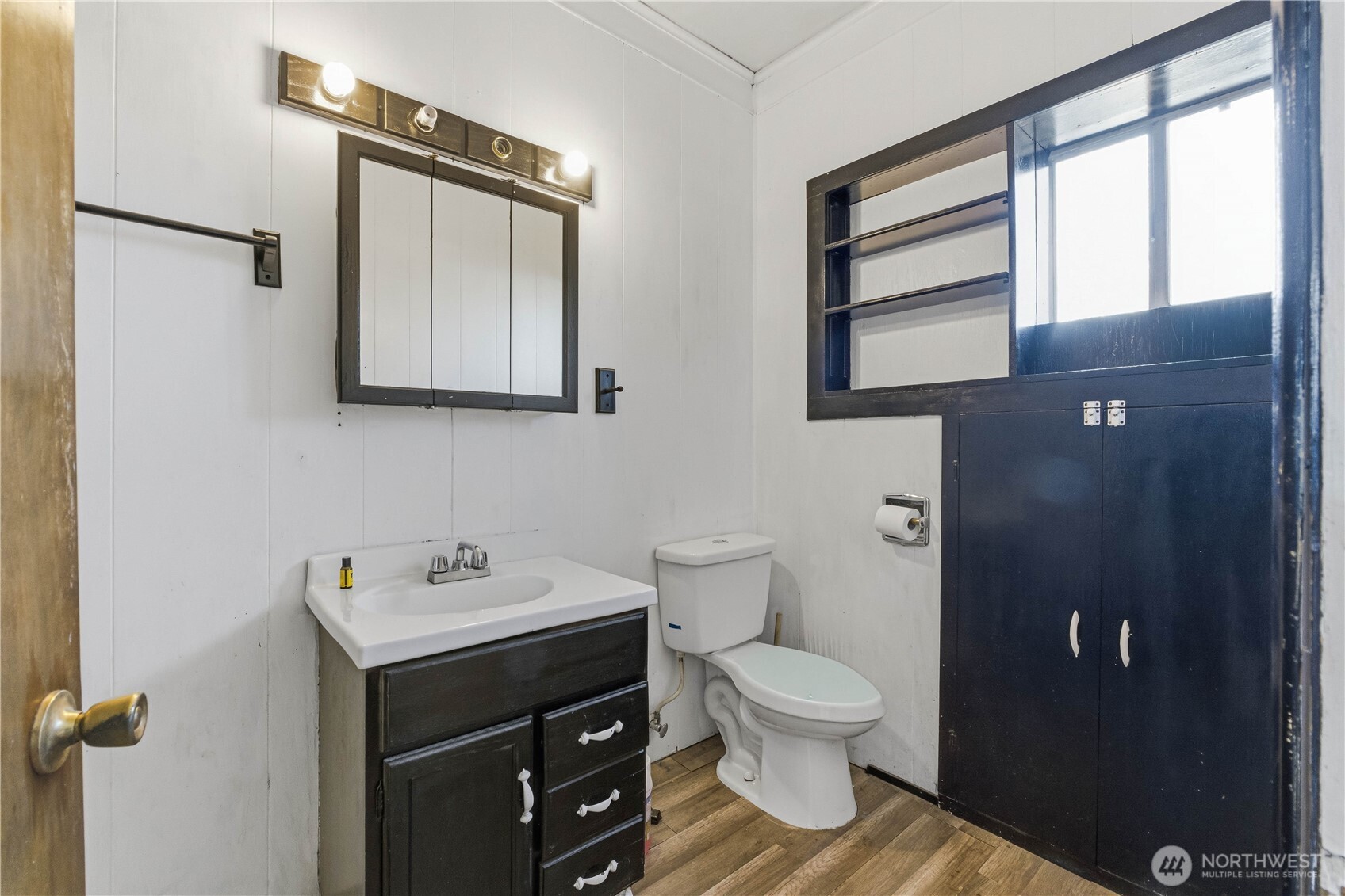 1248 South Mission Street Wenatchee, WA 98801 - Photo 5 of 22 a bathroom with a toilet sink and mirror