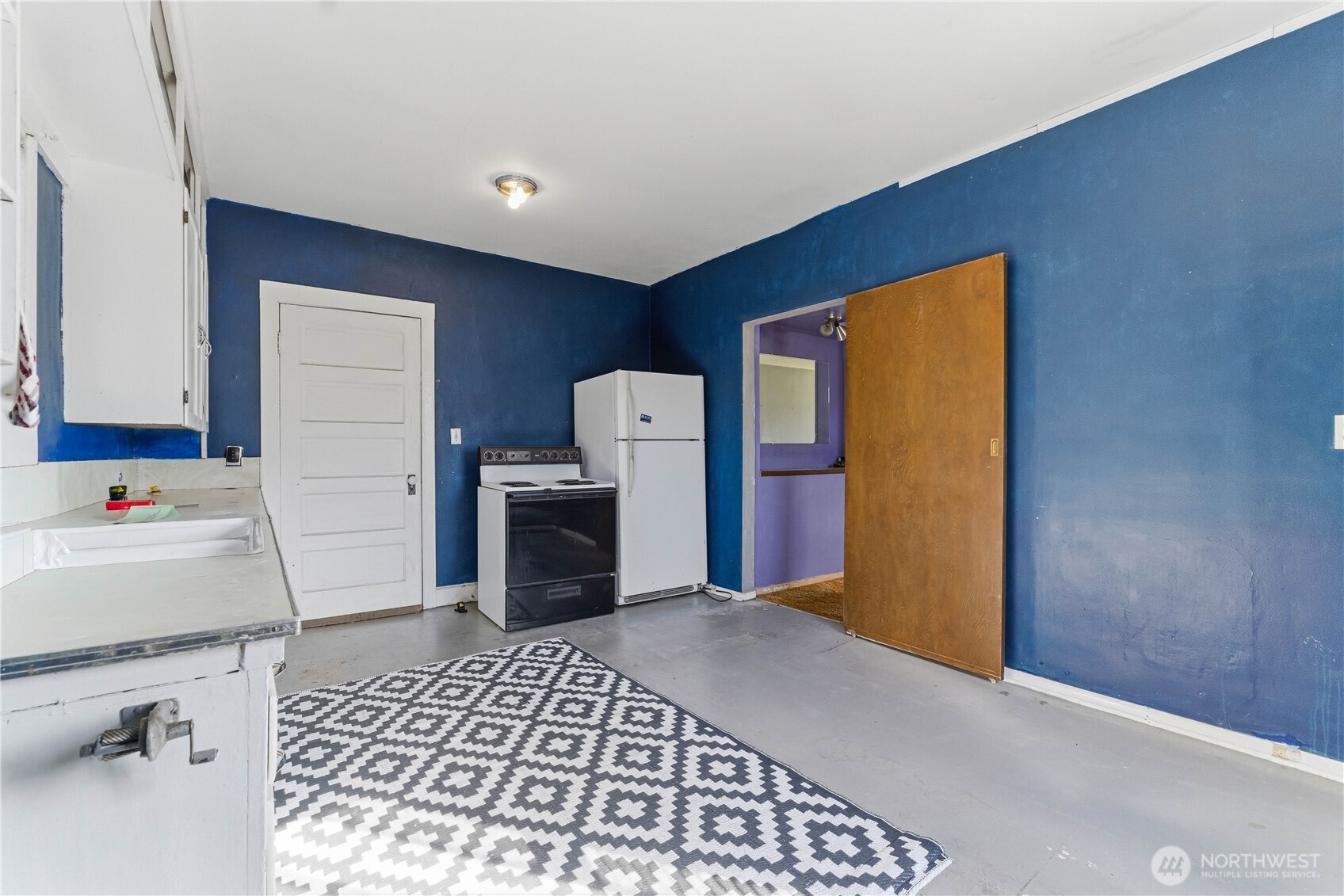 1248 South Mission Street Wenatchee, WA 98801 - Photo 7 of 22 a kitchen with a refrigerator and a stove top oven