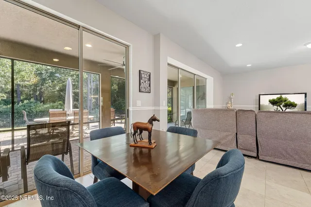 a bedroom with double bed and a large window