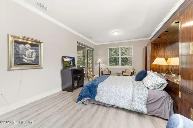 a bathroom with a granite countertop sink a mirror and a shower