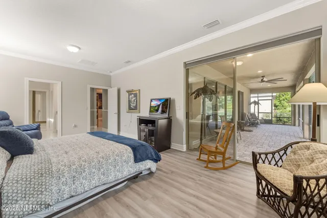 a spacious bathroom with a granite countertop sink a mirror and a shower