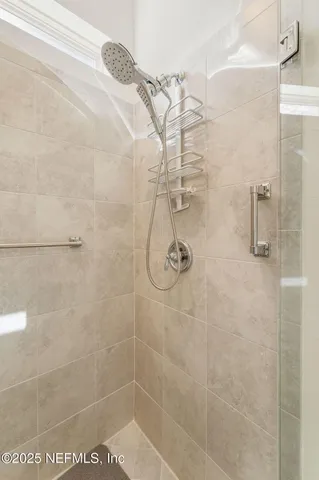 a living room with a couch and a large window