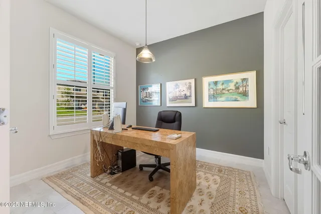 a view of a porch with chairs and backyard
