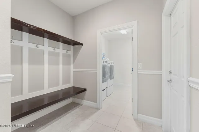 a front view of a house with yard and green space