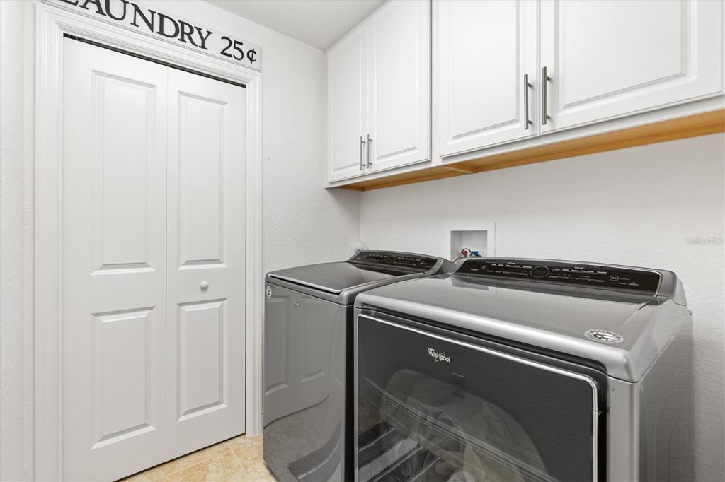 10404 Silver Maple Avenue Oxford, FL 34484 - Photo 24 of 41 a utility room with dryer and washer