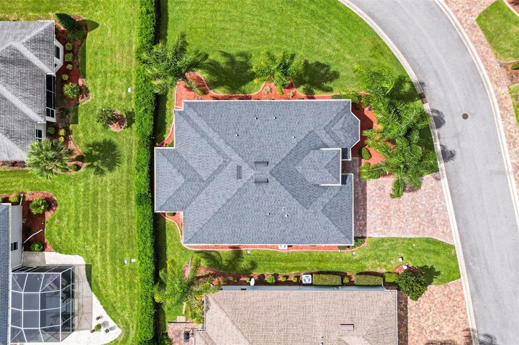 10404 Silver Maple Avenue Oxford, FL 34484 - Photo 31 of 41 an aerial view of a house with a yard and garden