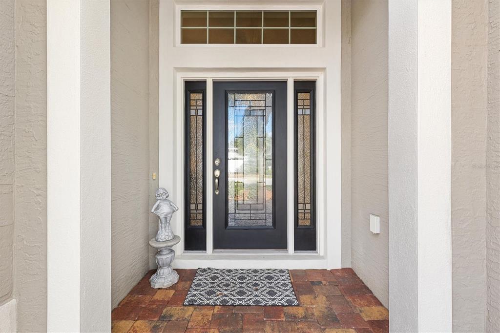 10404 Silver Maple Avenue Oxford, FL 34484 - Photo 4 of 41 a view of a door house with a porch