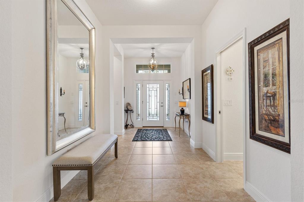 10404 Silver Maple Avenue Oxford, FL 34484 - Photo 6 of 41 a hallway with a large mirror and shower