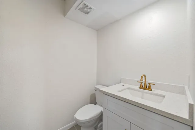 a bathroom with a toilet sink