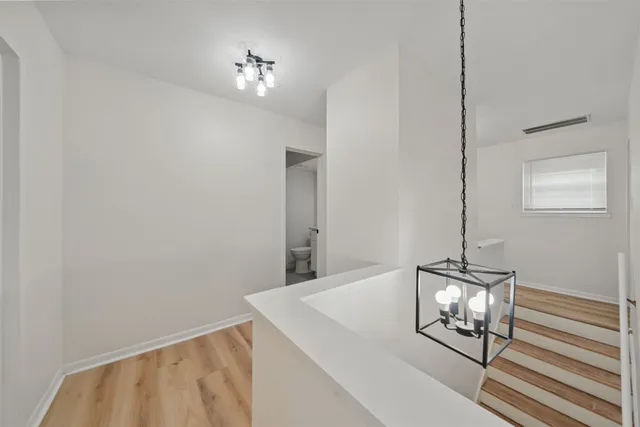 a view of a hallway with front door