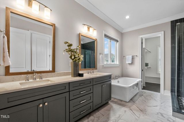 a bathroom with a window and a shower