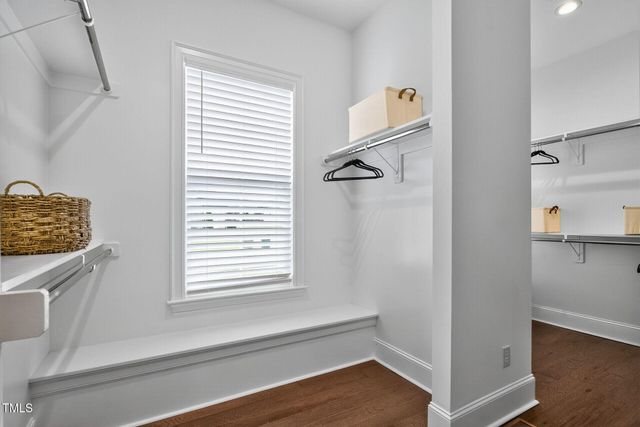 a view of room with furniture and wooden floor
