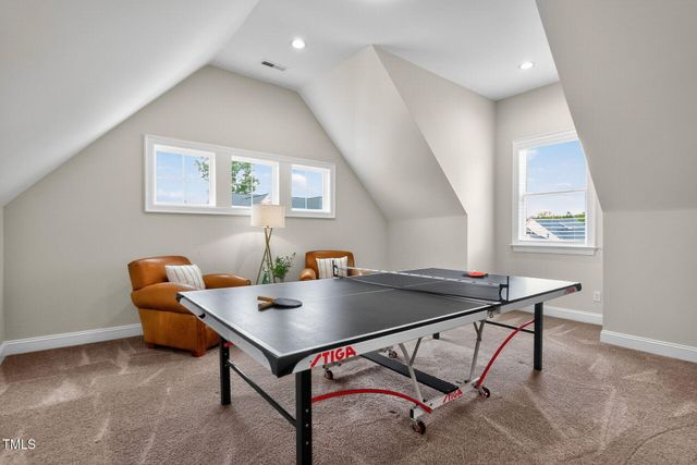 a bathroom with a granite countertop sink toilet and mirror