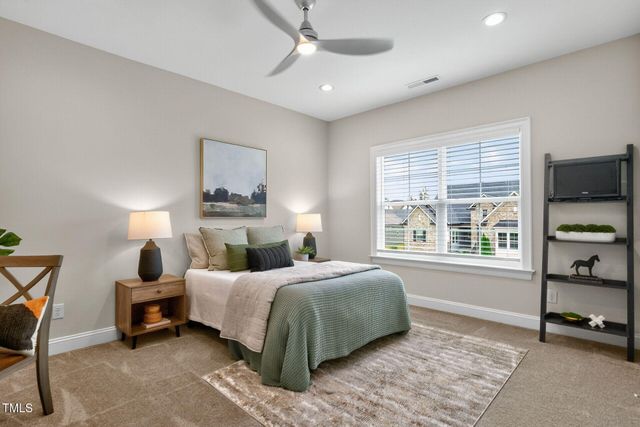 a bed room with a bed and a chandelier