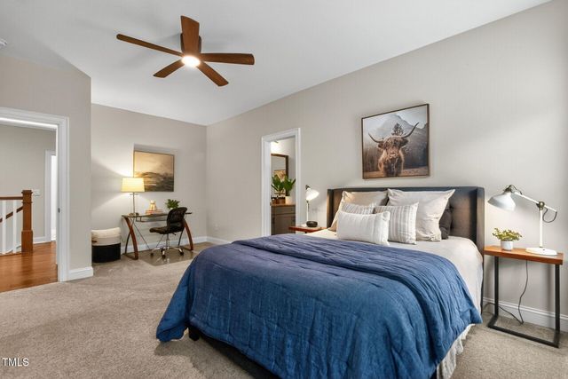 a bathroom with a sink a toilet and shower curtain