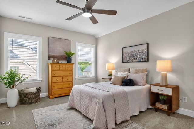 a living room with furniture and windows