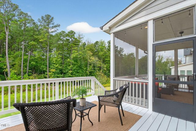 an aerial view of residential house with outdoor space and swimming pool