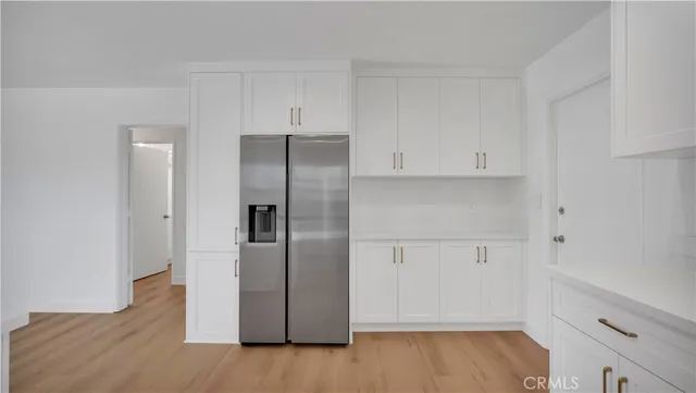 a view of cabinets and wooden floor