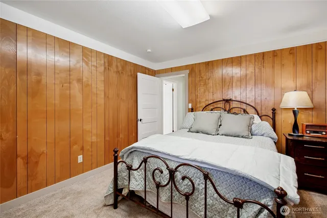 a bedroom with a bed and a table