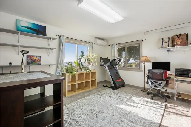 a view of a workspace with furniture